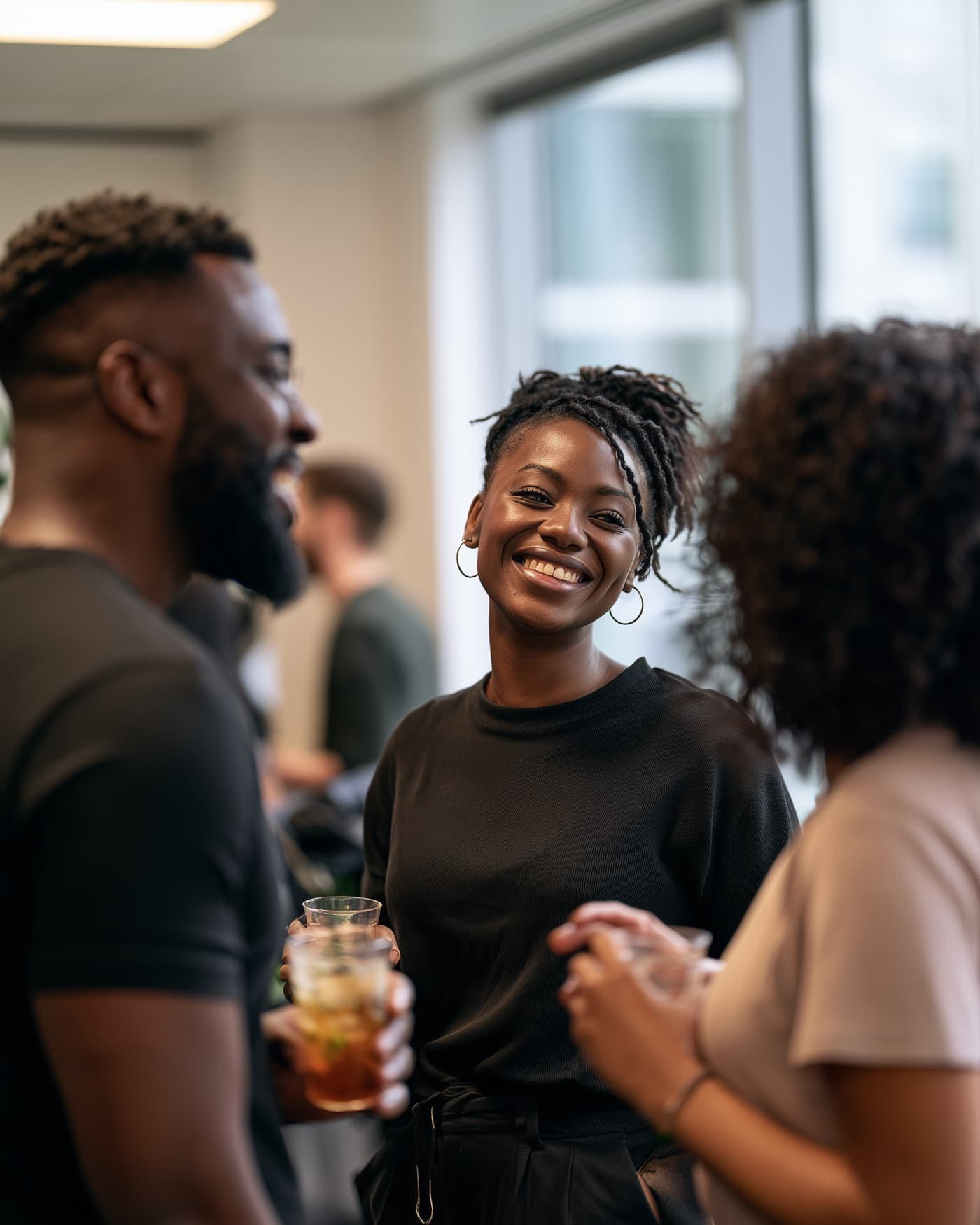 Colleagues chatting warmly together during a workplace break